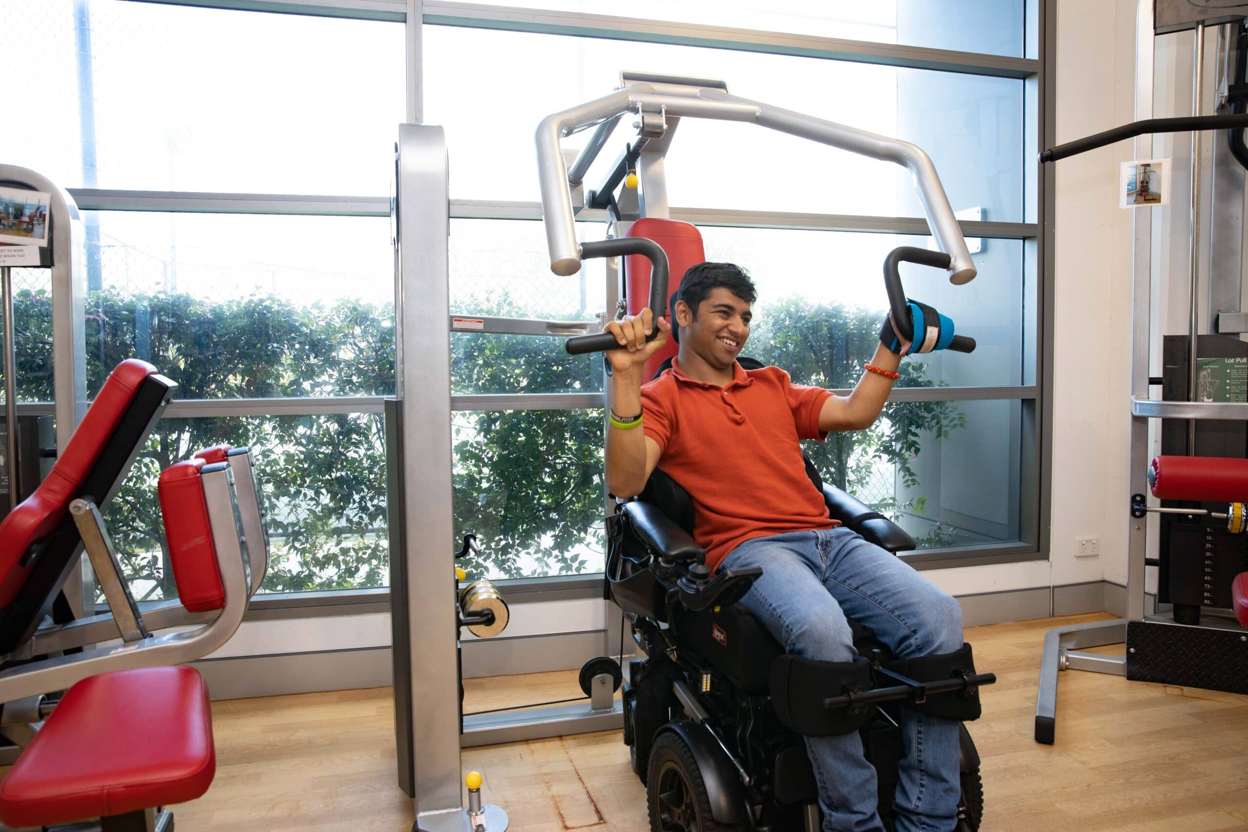 Aaryan Shah using exercise equipment in a gym