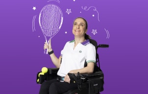 Lia sitting in her wheelchair holding a tennis racket