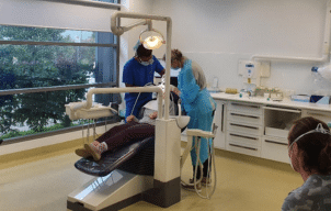 Dentists working on a patient at the dental clinic