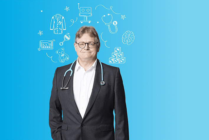 while male wearing glasses, a black suit, a stethoscope around his neck, on a blue background, surrouended by a halo of illustrations