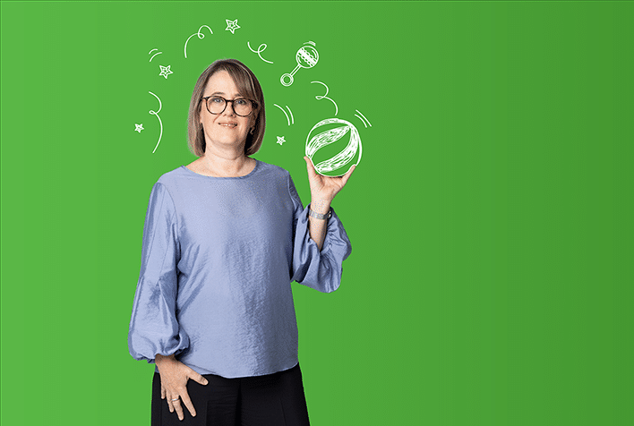 CPA researcher Cathy Morgan in a grey top holding a ball against a green background