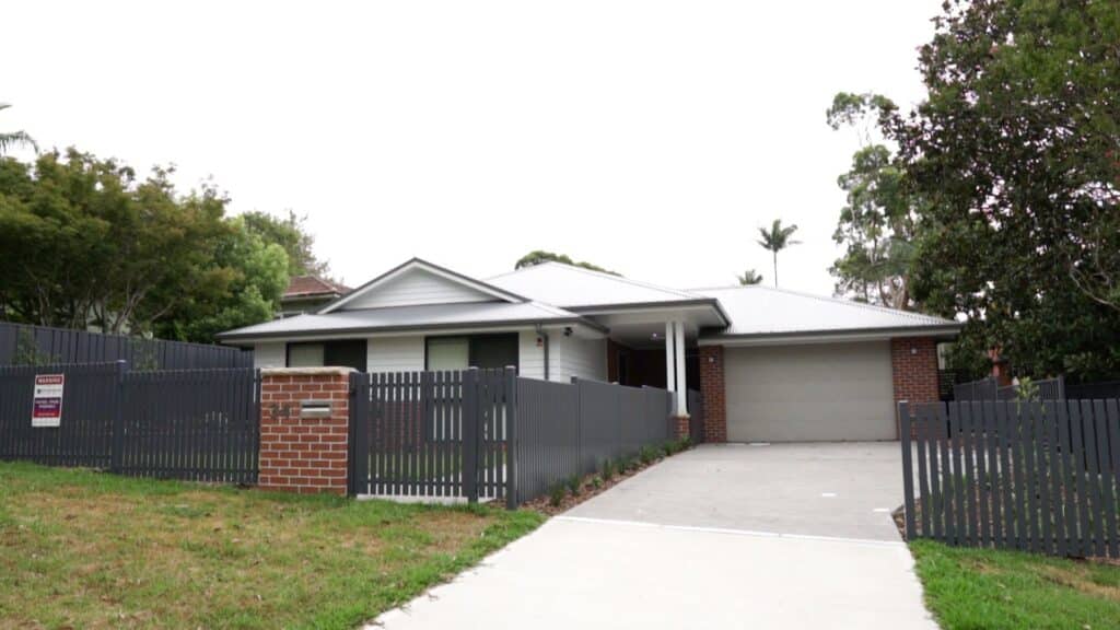 Front view of the Cromer 4 property with secure garage and fenced front yard