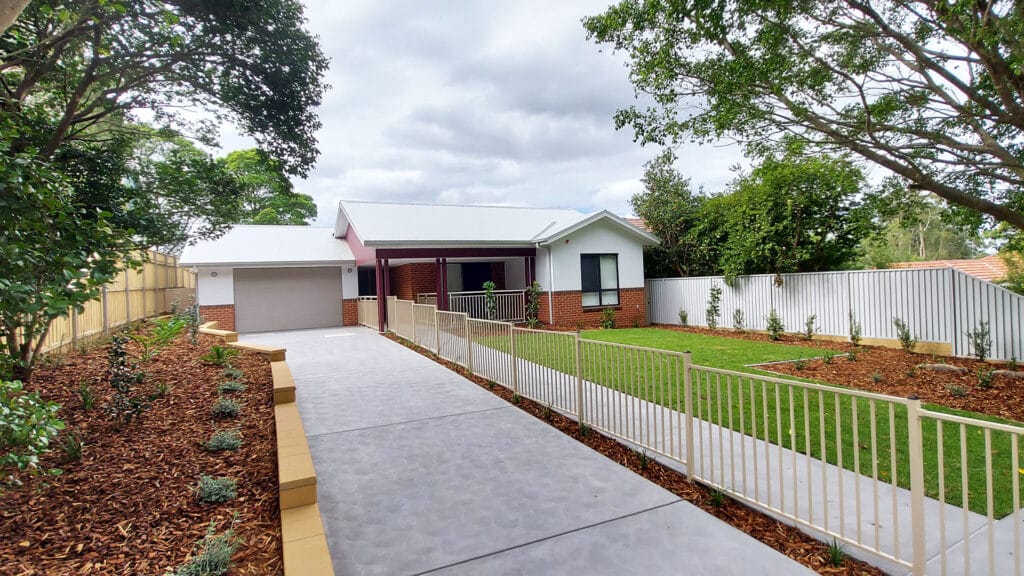 Front view of the Normanhurst 4 property with secure driveway and fenced front yard