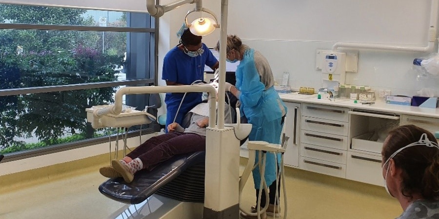 Dentists working on a patient at the dental clinic