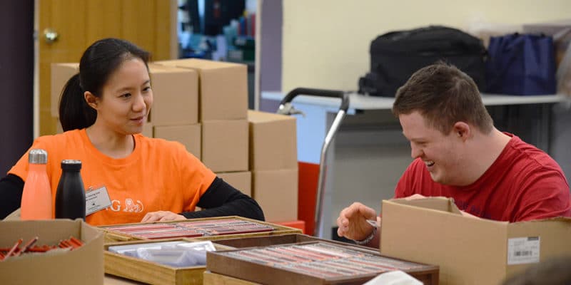 a packforce worker with a ING volunteer