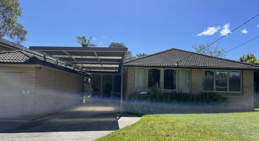 Front view of single story brick home in Terrey Hills