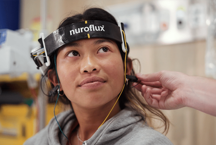 A Lady wearing Nuroflux around the head, a Remarkable innovation.