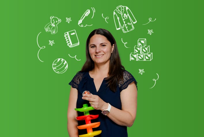 White woman with dark top and dark hair holding a child's toy, set againast a green background surrounded by illustrations.