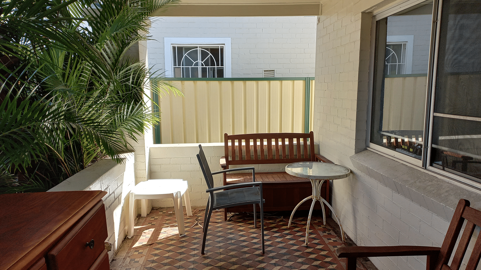View of the undercover front verandah with outdoor furniture.