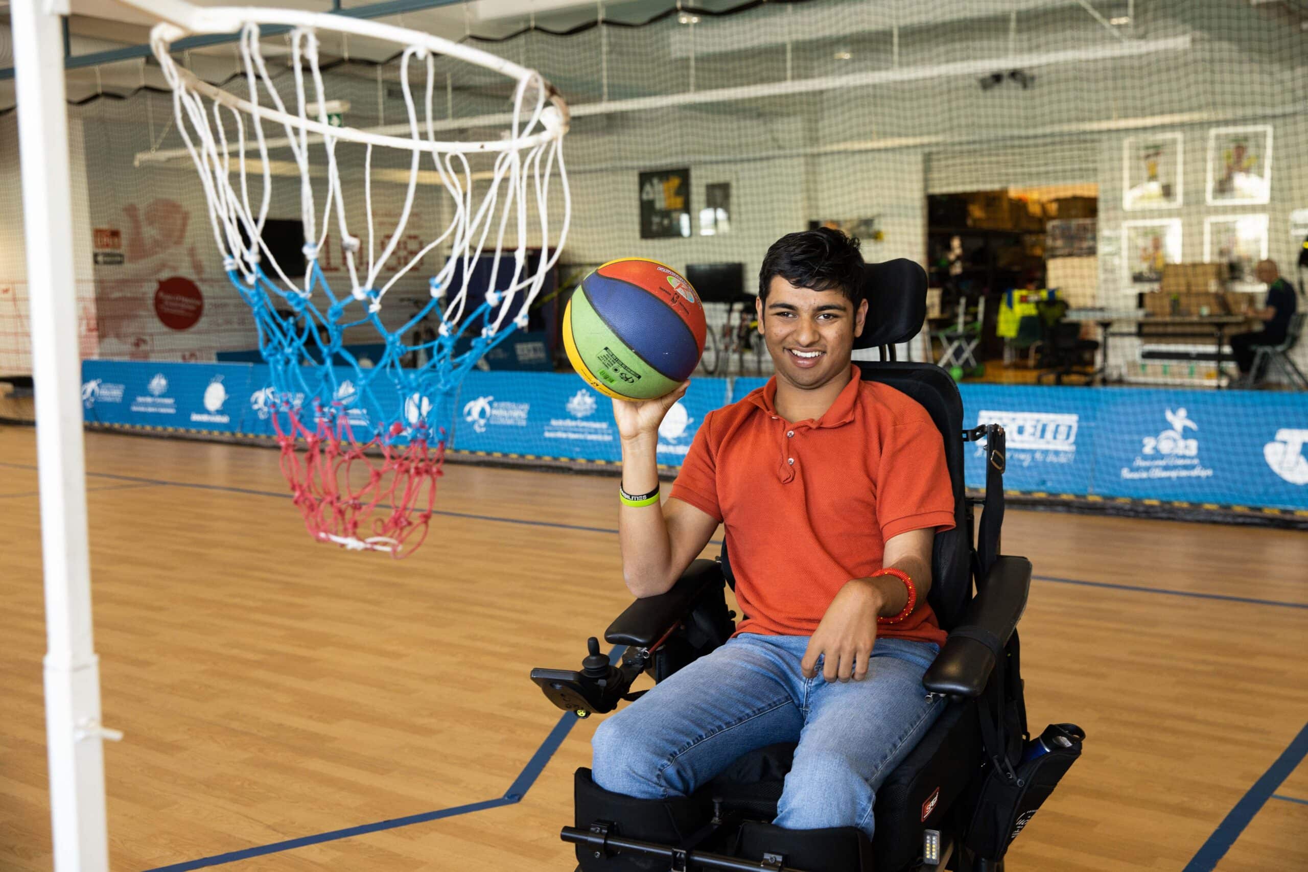 Aaryan Shah playing basketball in a gym