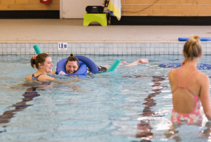 A female participating in water therapy at the hydrotherapy pool.
