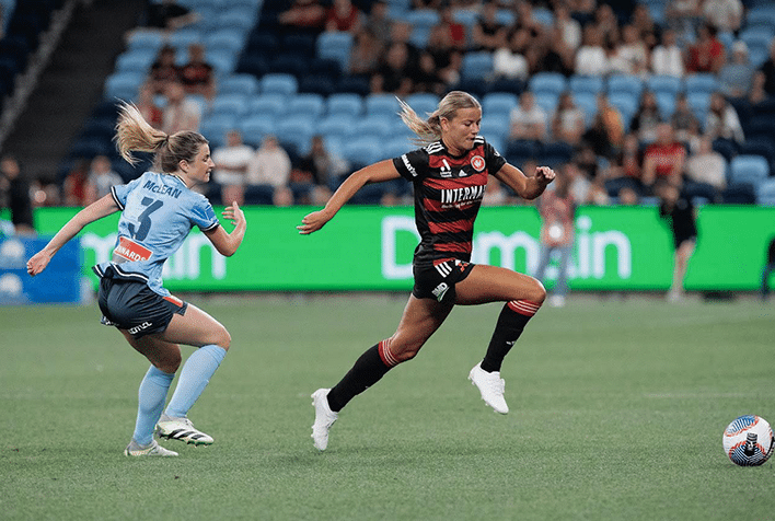 Sophie Harding playing soccer on the field for the Western Sydney Wanderers.
