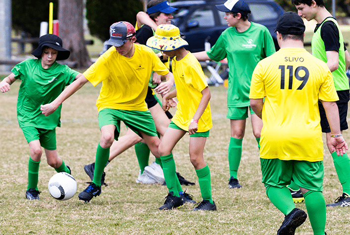 A group of young boys playing soccer