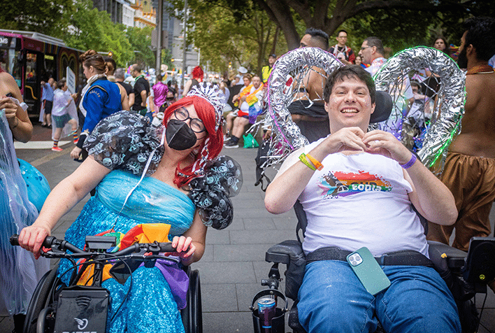 Two wheelchair users in costume at the Sydney mardi gras