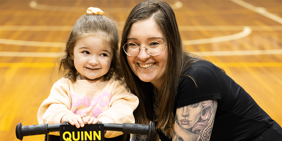 Quinn and her mum Alicia, smiling together for a photo