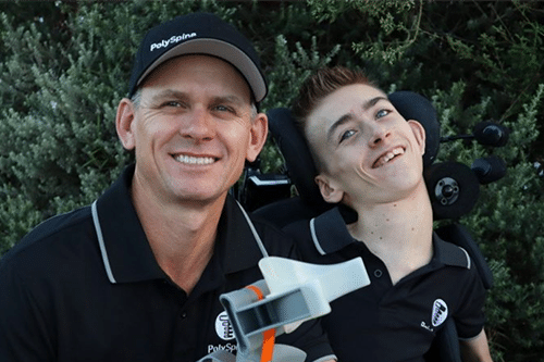 Riley and his father Clint with their Polyspine support.