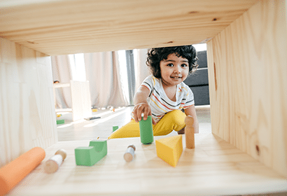 A young child playing with blocks