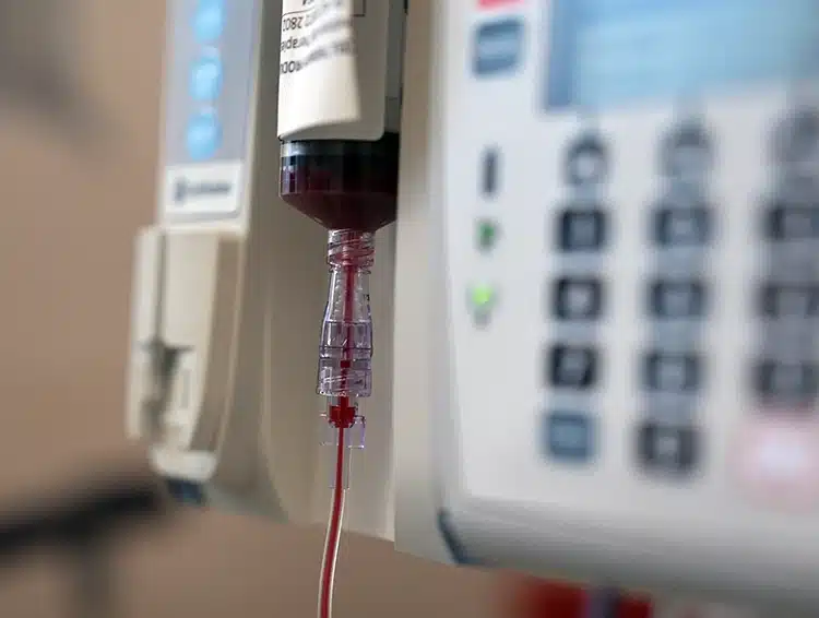 A close up of Zara's umbilical cord blood vile during the infusion