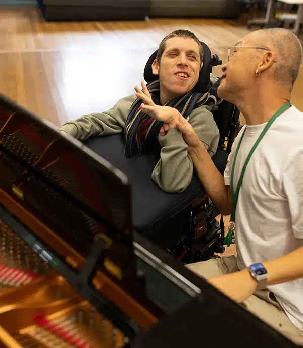 Will enjoying a music session on the piano with a support worker at cpa lifestyles