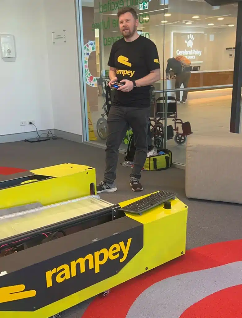 Founder of Rampey Jay Davey during a demo using the robot ramp.