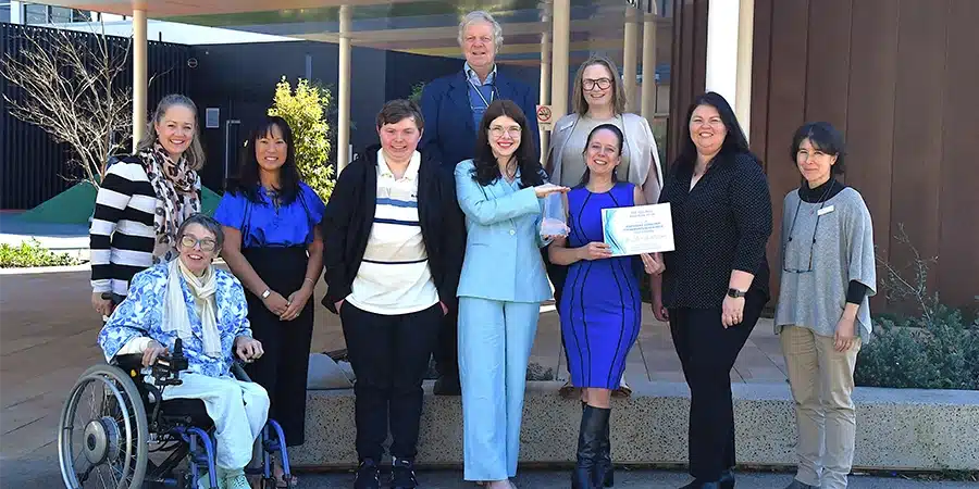 The Westmead Feelings Project team smiling for a photo with their award