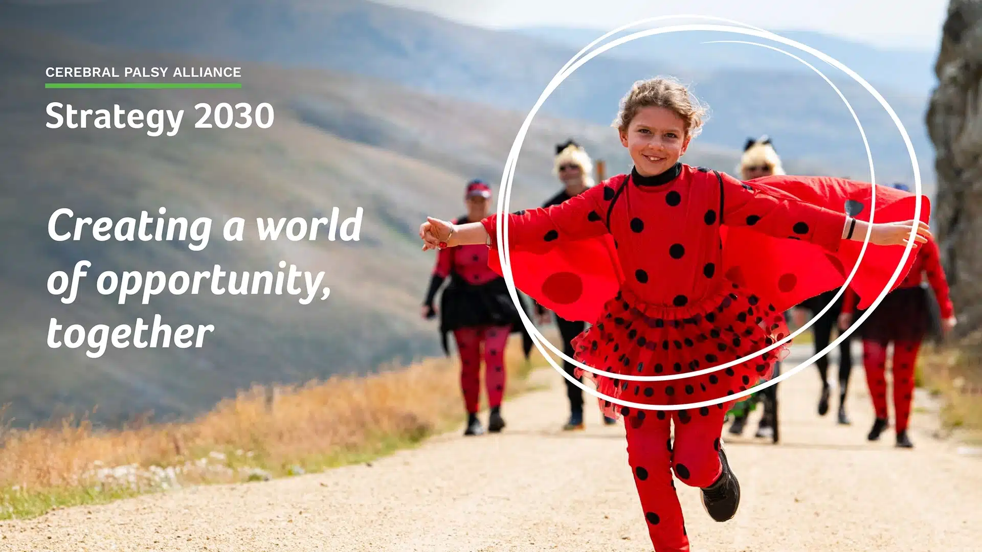 Cerebral Palsy Alliance Strategy 2030 cover image of a little girl dressed as a ladybug running up a hill, folloowed by her family while participating in the Krazy Kosci Klimb