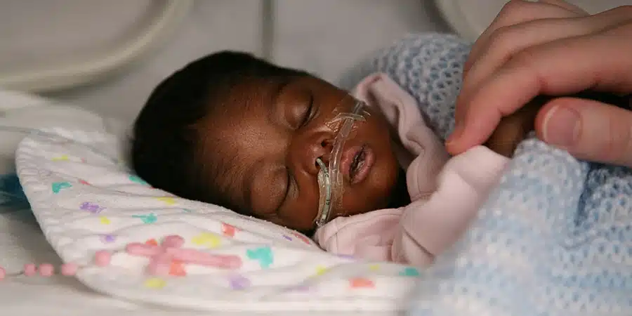 A premature baby sleeping in hospital