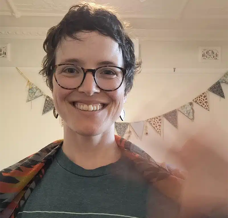 Researcher Sierra Willow smiling and waving to the camera