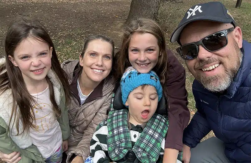 Bennett at a park with with his family, parents Doug and Megan and his big sisters Zoe and Winnie.