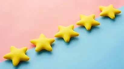5 yellow 3d stars on a blue and pink background