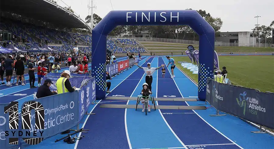 View of the finish line at the race track with Quinn just finishing the race