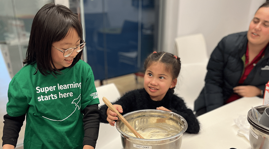 Two children participating in a HABIT-ILE intensive therapy activity focused on developing everyday functional skills.
