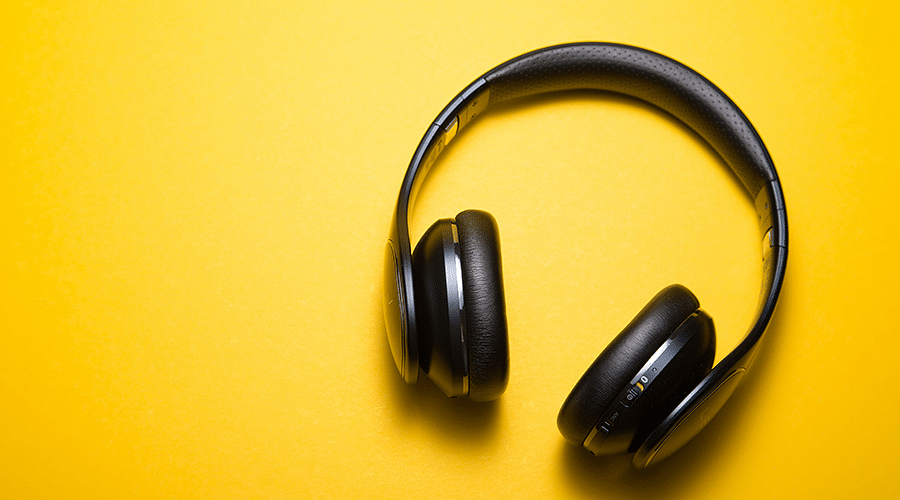 Black headphones on a yellow background