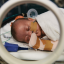 newborn baby in an incubator in hospital