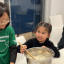 Two children participating in a HABIT-ILE intensive therapy activity focused on developing everyday functional skills.