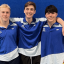 Three teenage boys wearing blue and white sport jerseys.