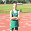 Zac Harding wearing his Australia uniform, posing for a photo at a running track.