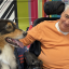 Lifestyles client Tony enjoying time with the therapy dog