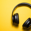 Black headphones on a yellow background
