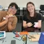 Two female participants working on toys at the switch adapt workshop