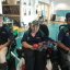 Three wheelchair boccia players